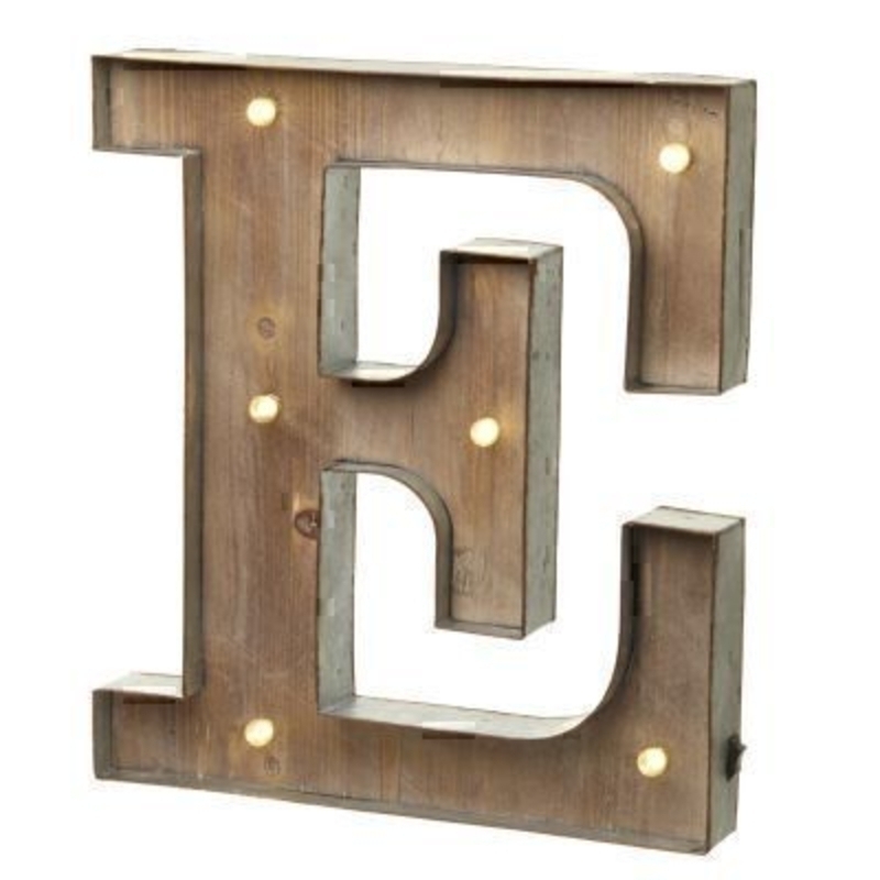 This E Sign With LED Lights by Heaven Sends could be paired with other letters to create a bespoke initial sign for a couple or to be displayed on its own. Large in size this S sign has got LED lights and a switch on the side to turn it on. Made from wood and metal. Size: 27x5x41cm